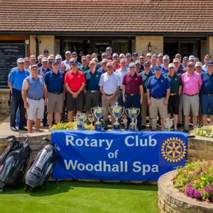 Members of the Rotary Club of Woodhall Spa gathered behind the club banner
