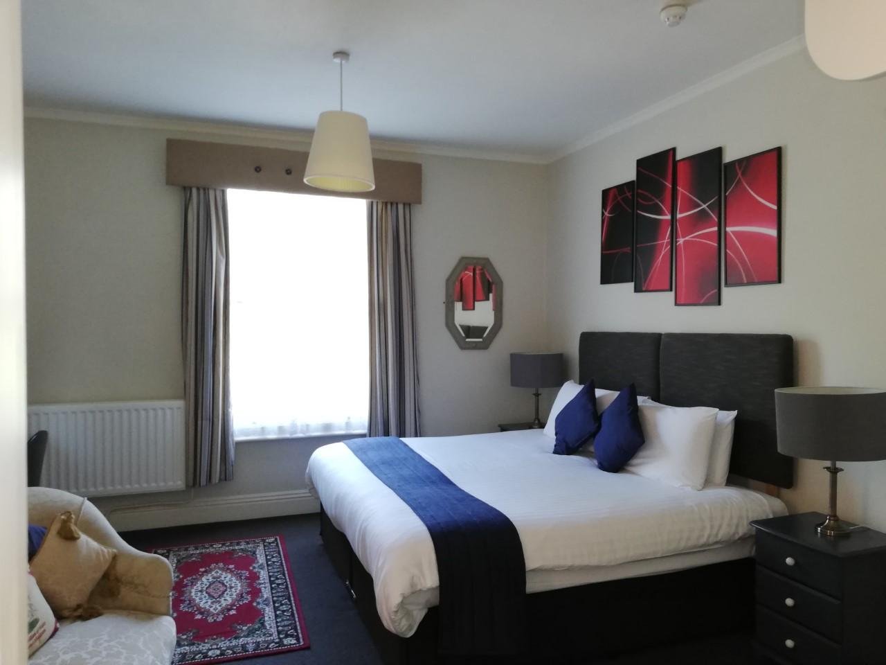 A comfortable guest bedroom at The Claremont