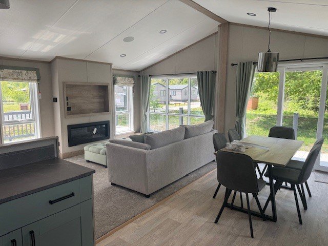 The open-plan interior of a lodge at Woodhall Country Park