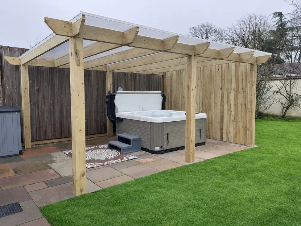 The private covered hot tub in the garden at Daisy Tree Cottage