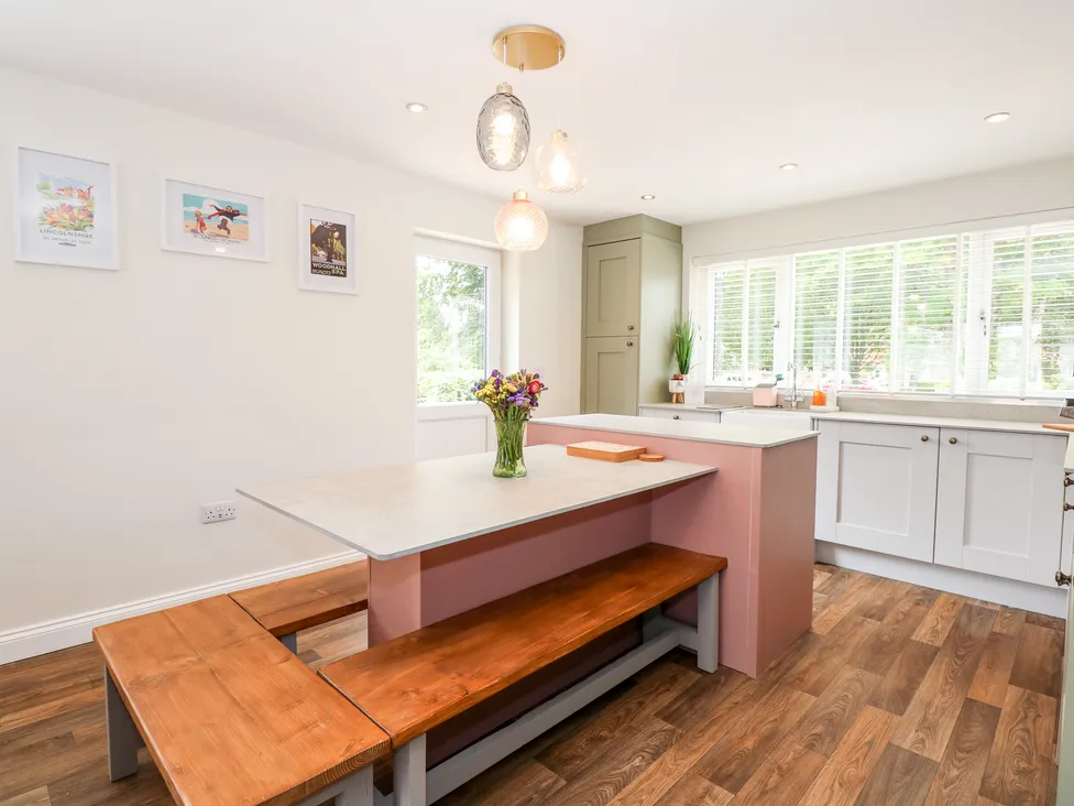 The colourful, fully equipped kitchen at Daisy Tree Cottage