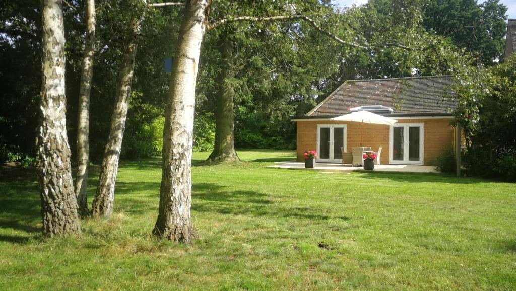 Spinney on the Green cottage viewed across its lawn