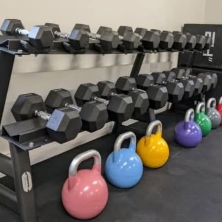 Dumbbells and colourful kettlebells at re:new gym