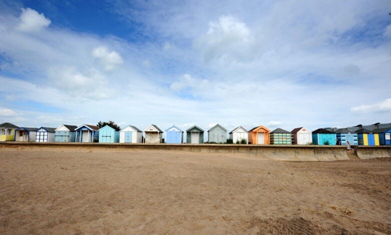 Colourful beach huts beside the sand on the Lincolnshire coast