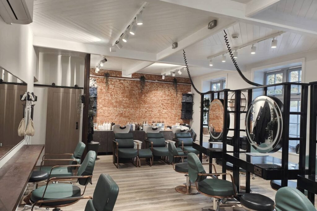 Styling chairs and wash basins inside re:new hair and beauty salon in Woodhall Spa