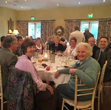 Woodhall Spa St Barnabas fundraising supporters seated around a dining table, pictured in the charity’s 2017 newsletter