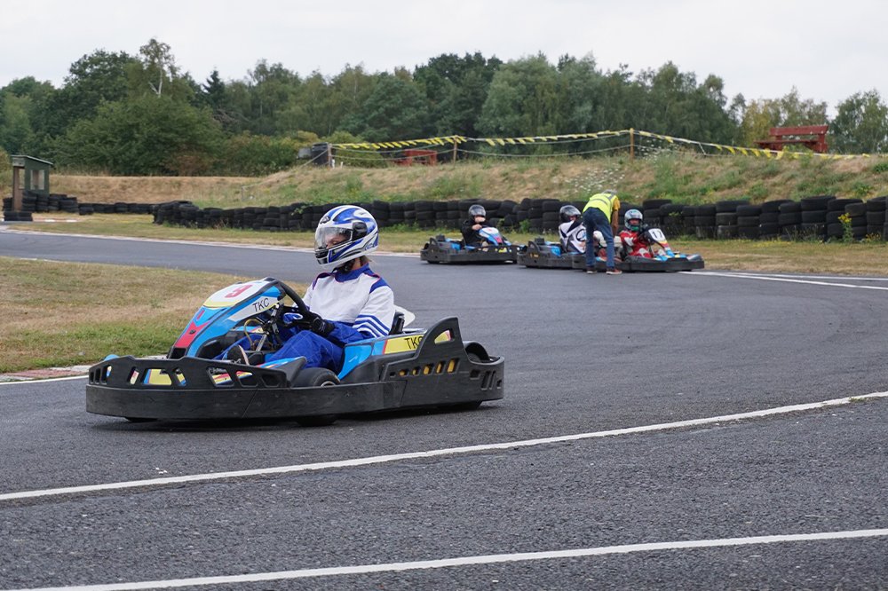 Helmeted driver rounding a bend at Tattershall Kart Centre
