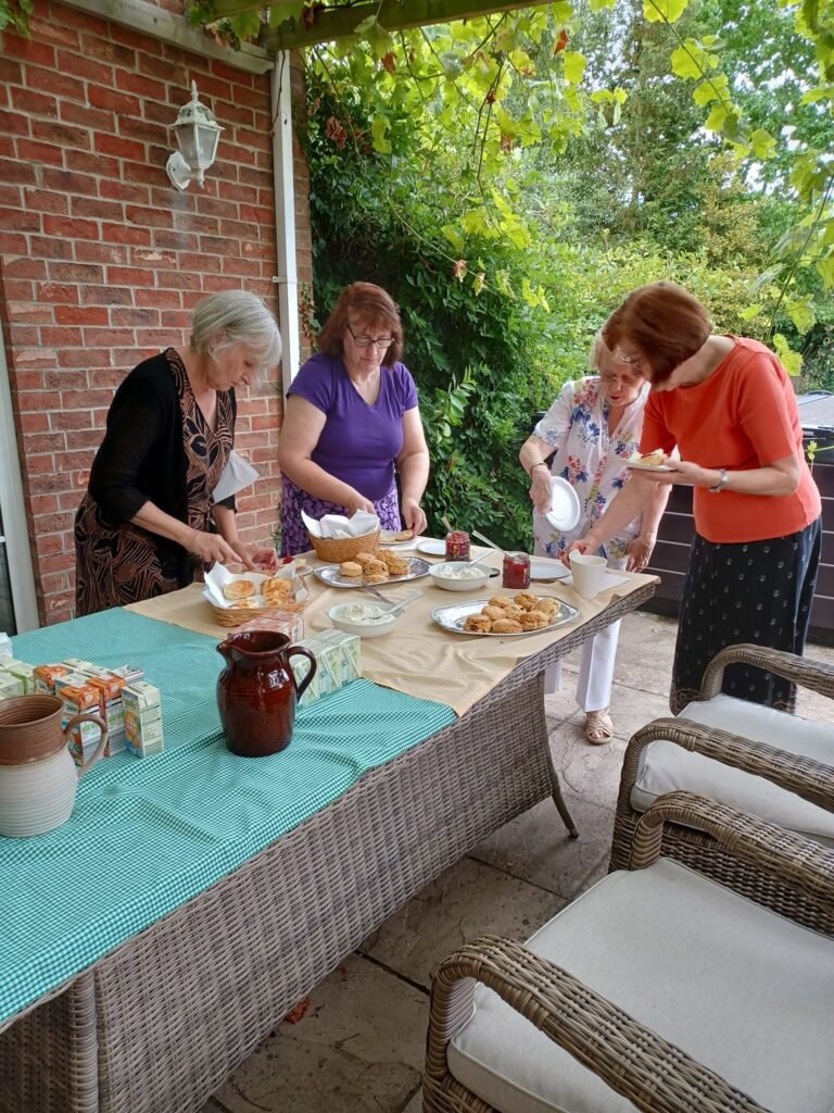 Woodhall Spa WI members sharing afternoon tea outdoors